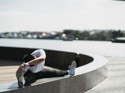 Blurred motion of a person practicing stretching exercises